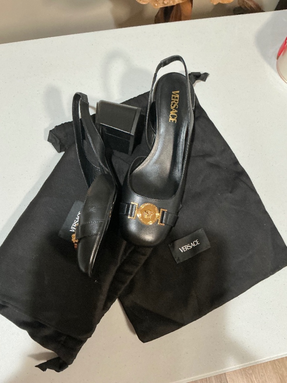 New Versace black leather gold Medusa accent sling back block heels